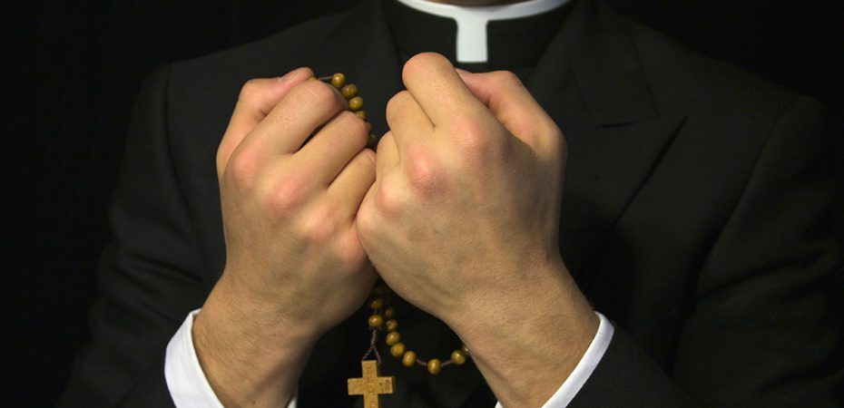 Priest praying
