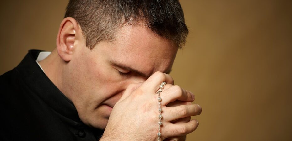 Praying priest