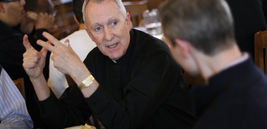 Priest chats with seminarian during retreat at New York seminary